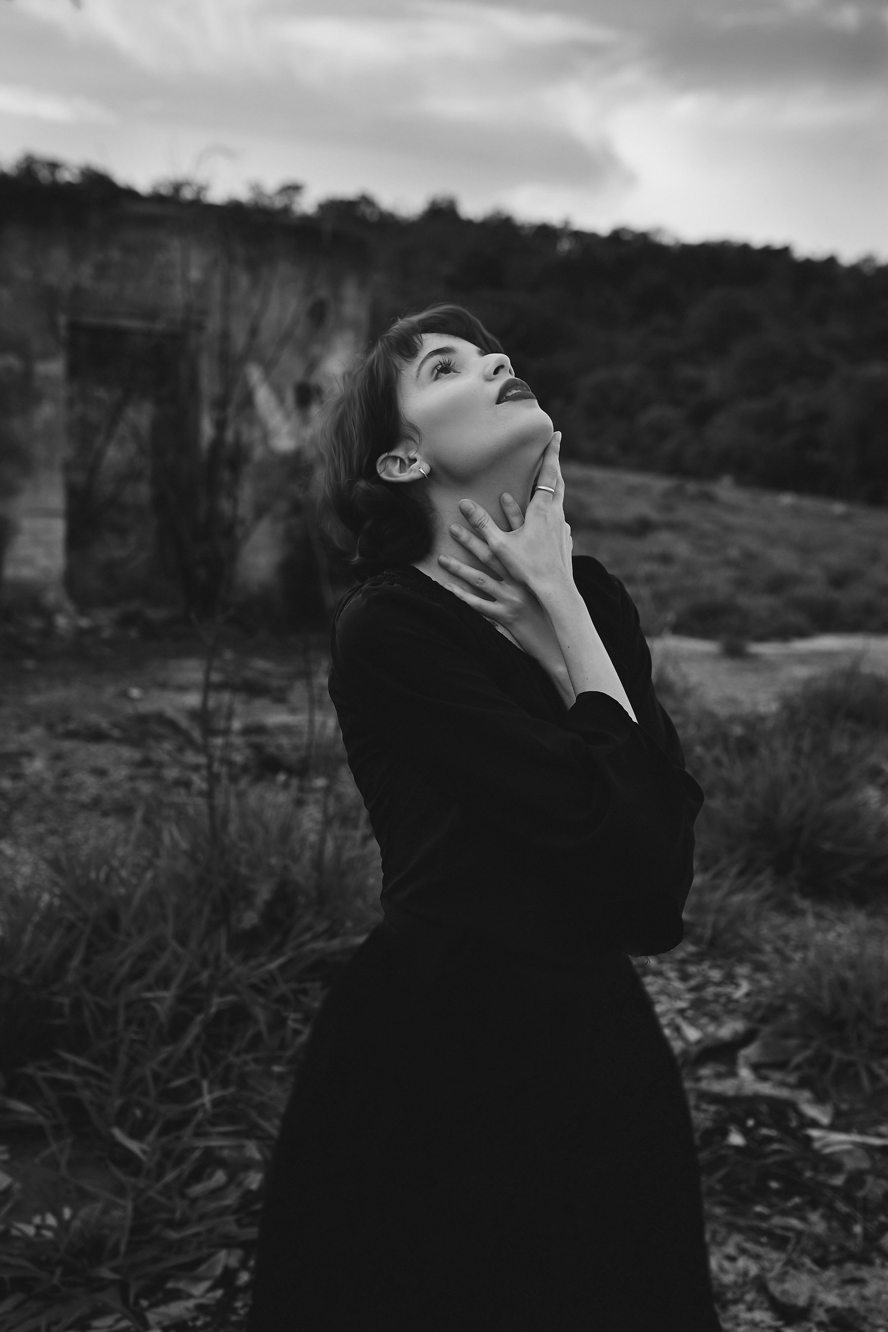 Woman in Black Dress Looking Up